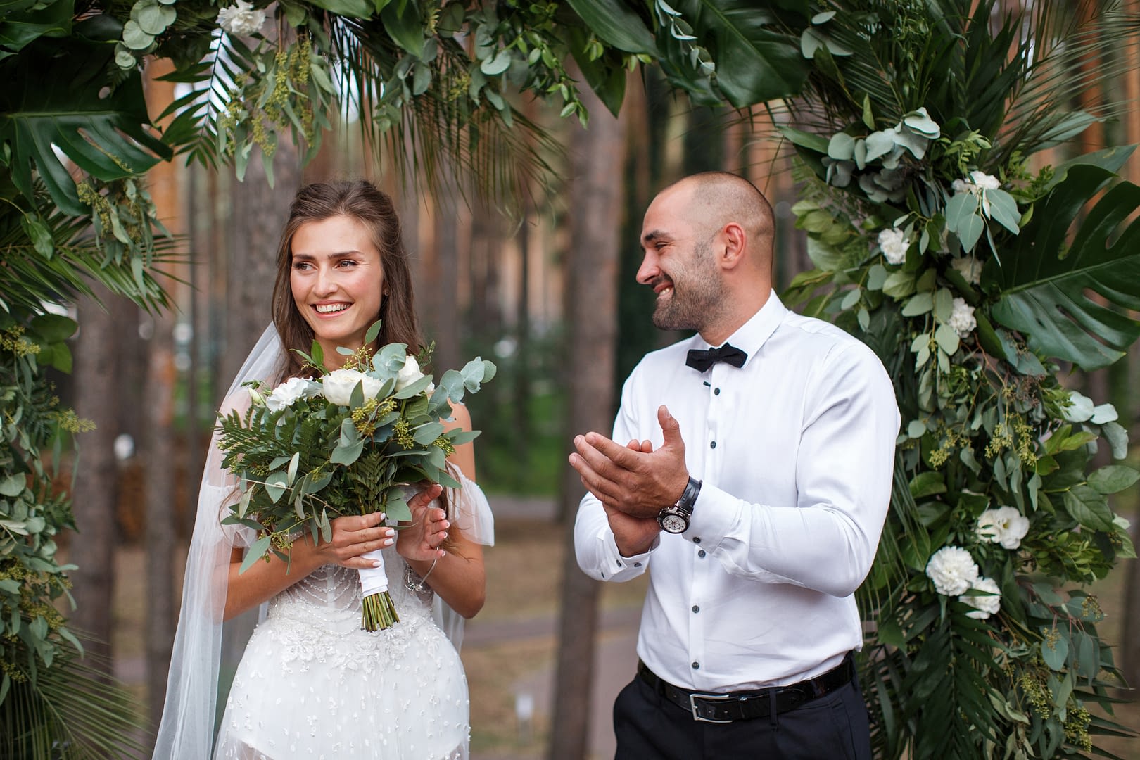 Beautiful newlyweds at the outdoor wedding ceremony
