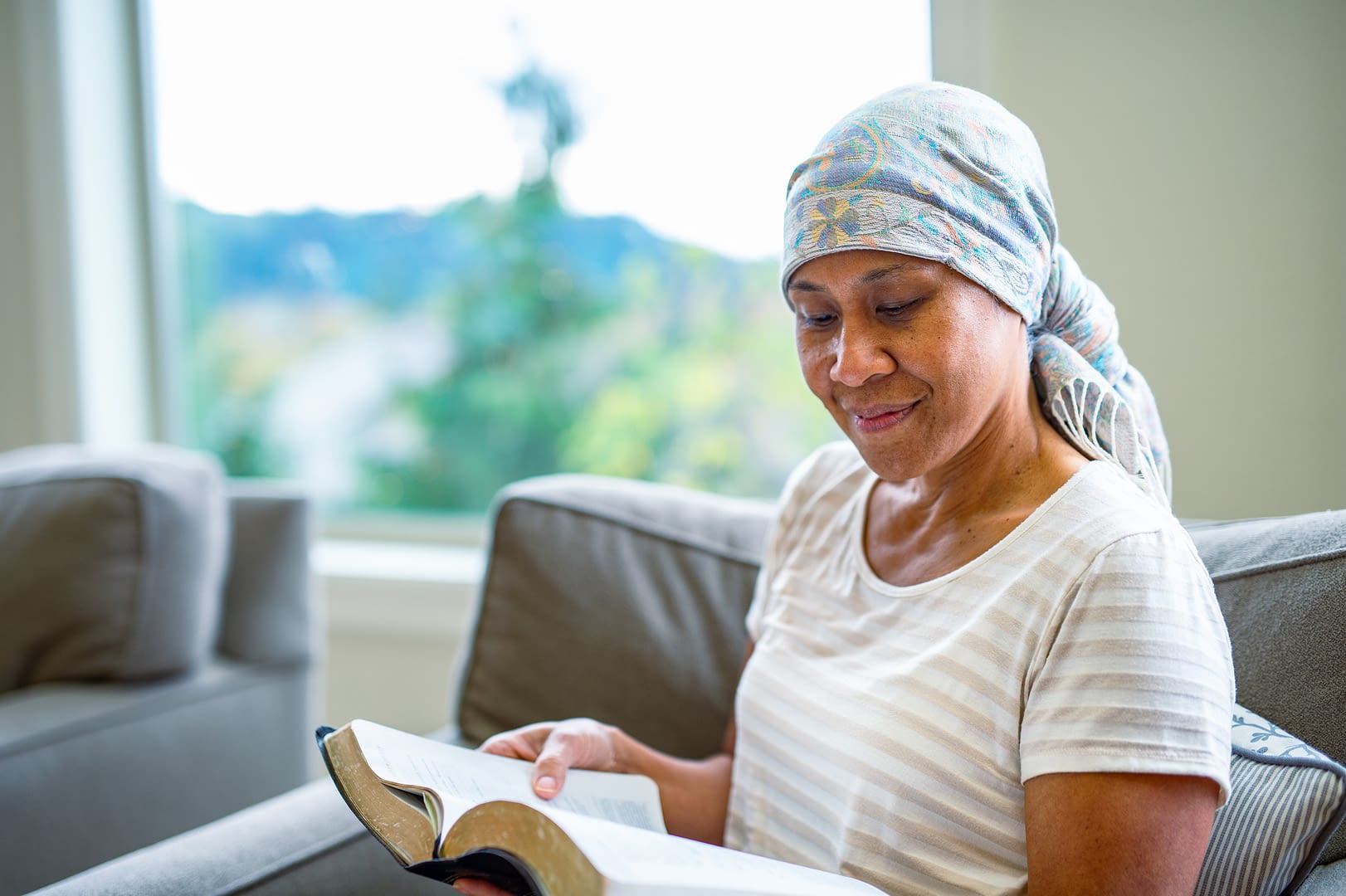 Senior woman reads at home