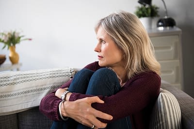 Worrying Caucasian woman hugging legs Encouragement for Life's Trials