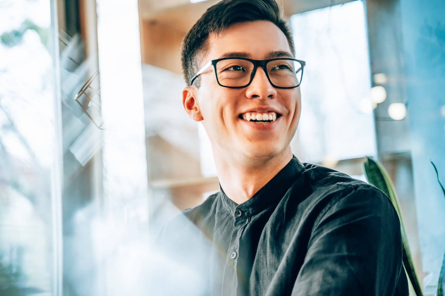 young asian man smiling