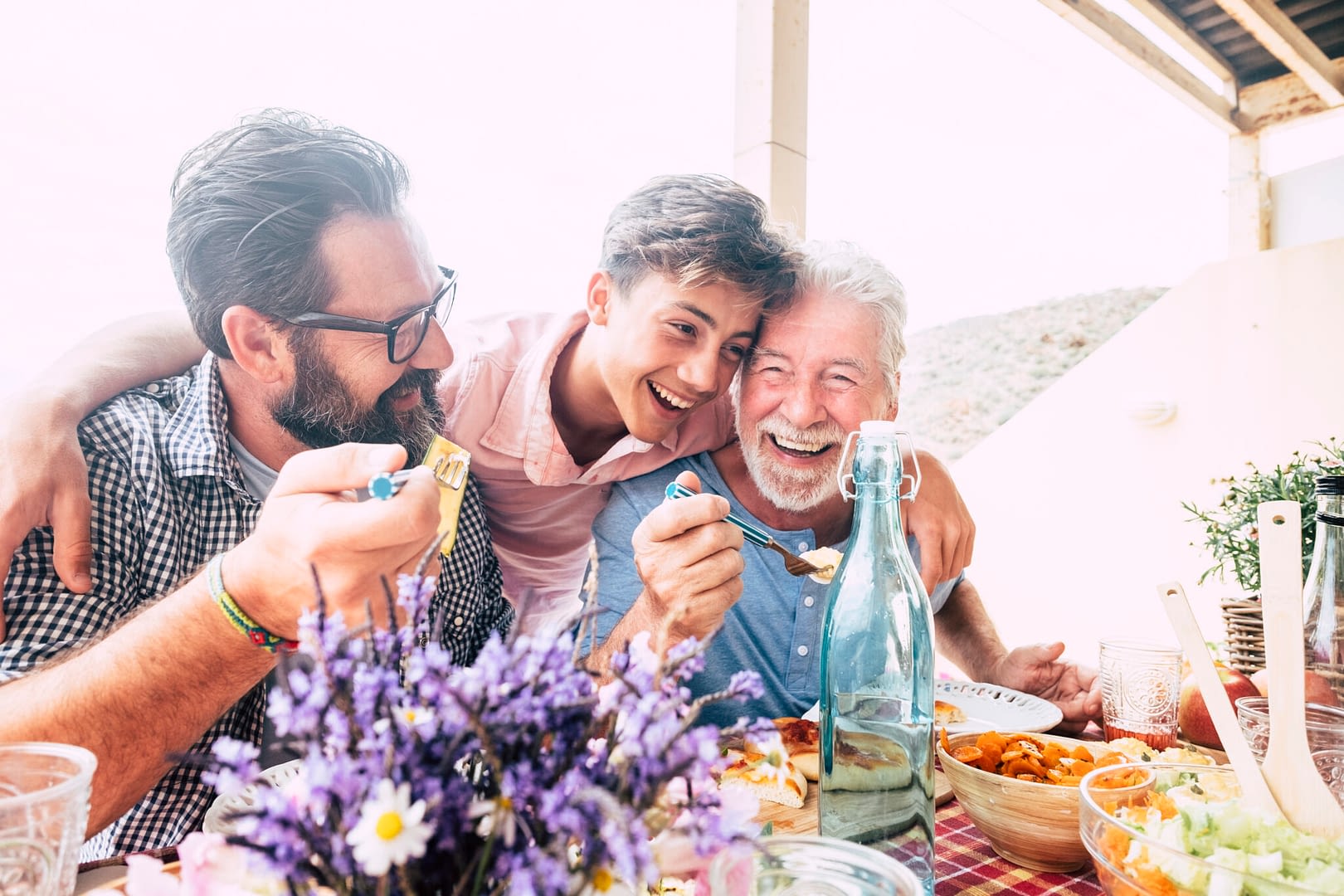 three generations enjoying a meal