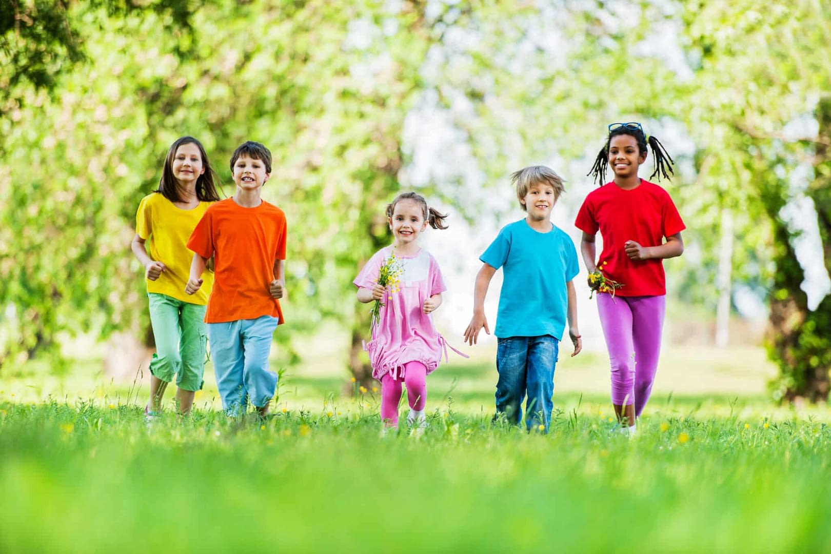 Group of children running in nature