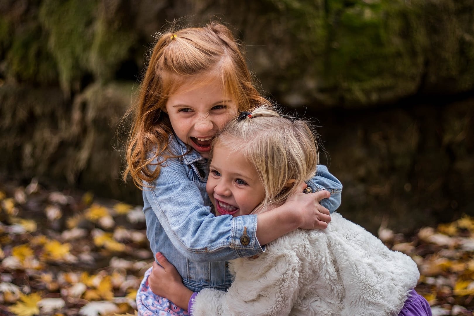 sisters hugging outside
