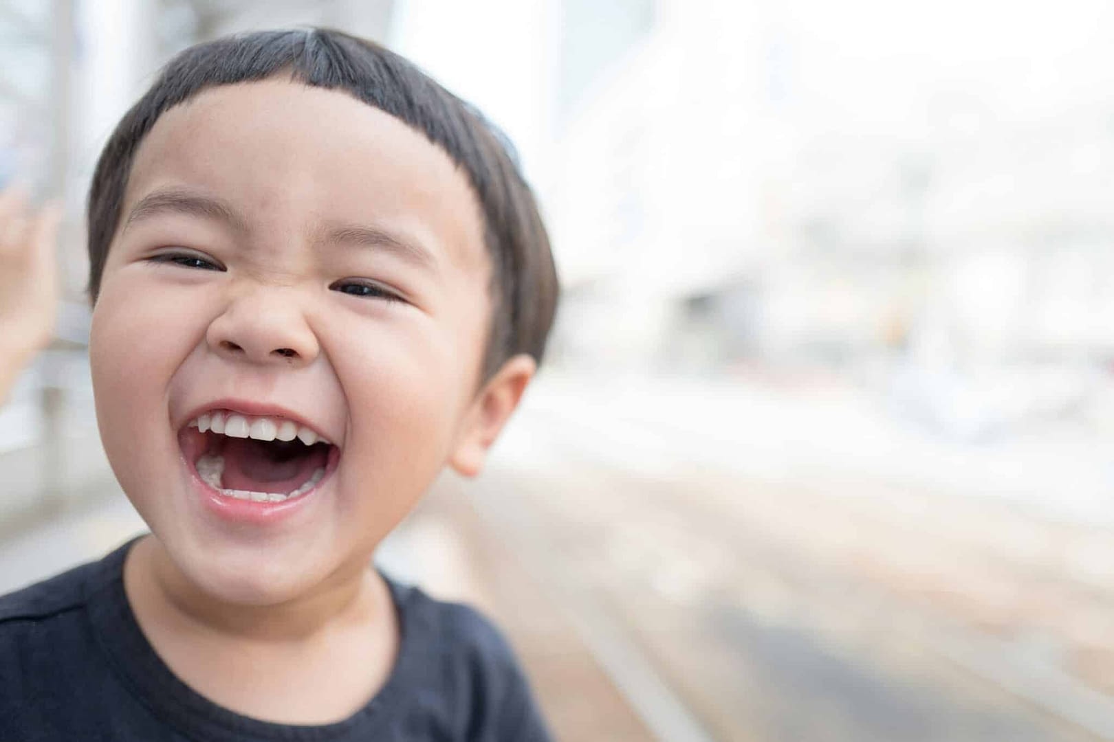 very happy asian toddler