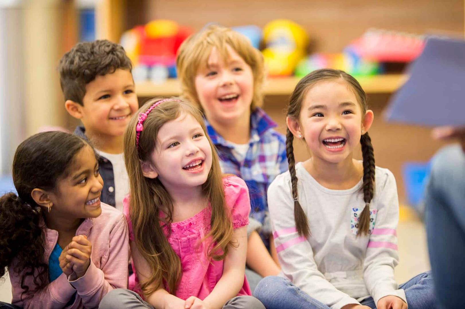 Children Smiling While Listening to a Story