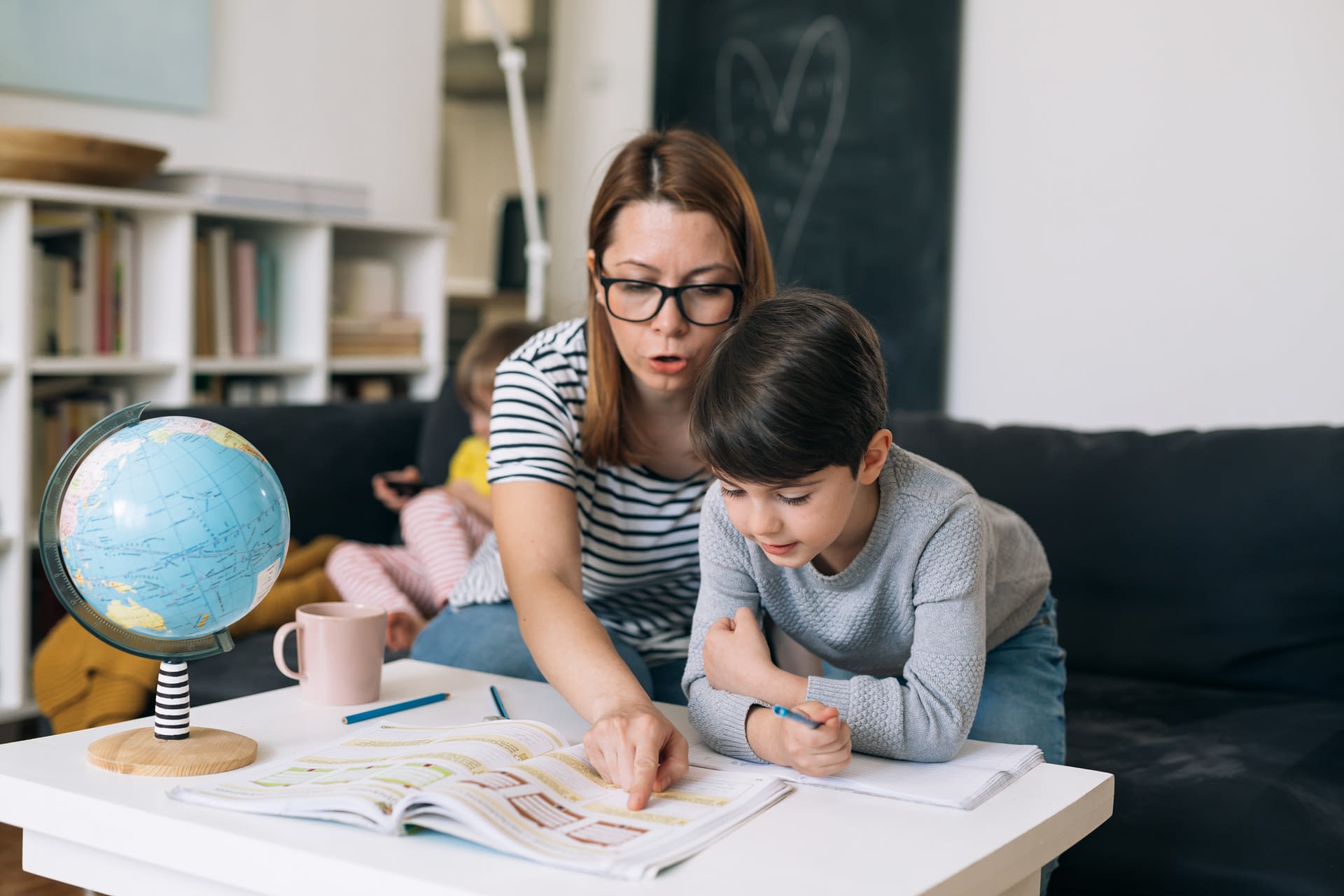 mother and son doing homework